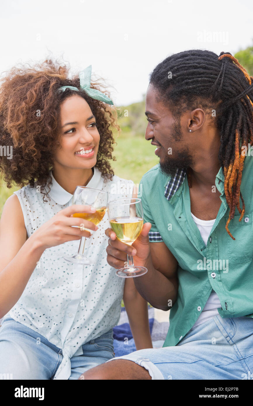 Young couple on a picnic drinking wine Stock Photo - Alamy