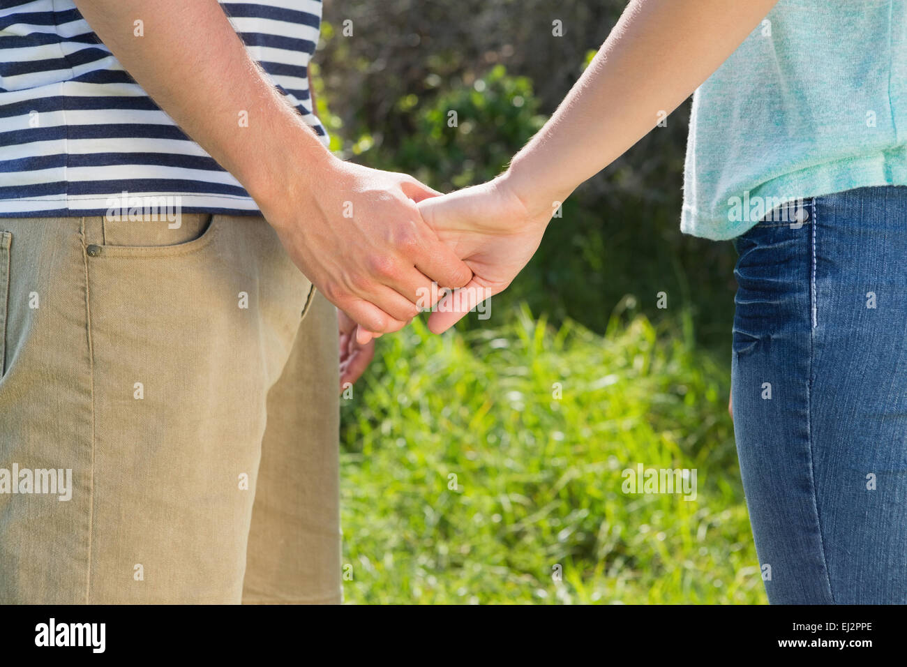 Park couple holding hands hi-res stock photography and images - Alamy