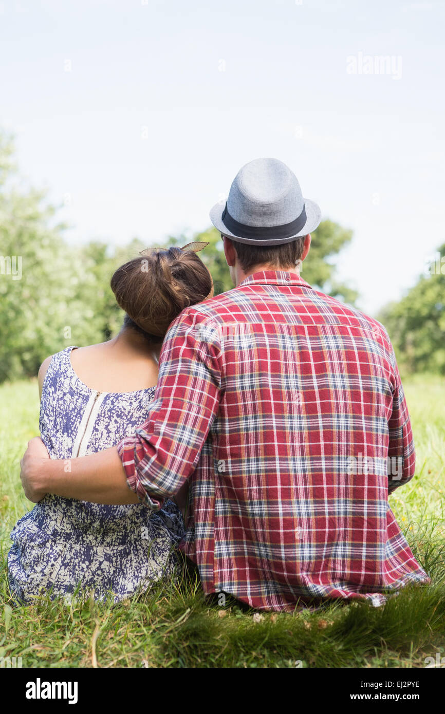 Couple relaxing in the park Stock Photo - Alamy