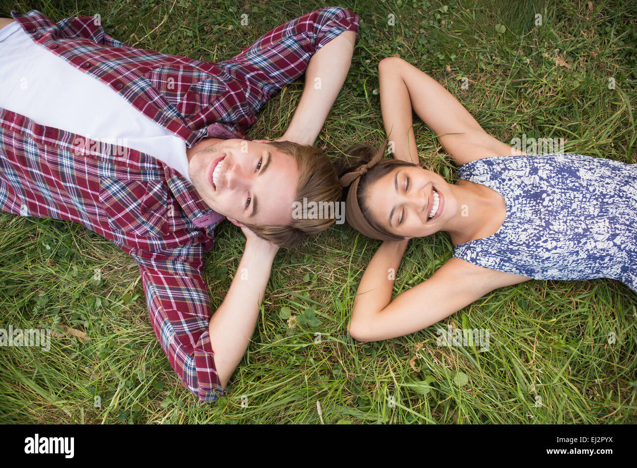 Couple relaxing in the park Stock Photo - Alamy