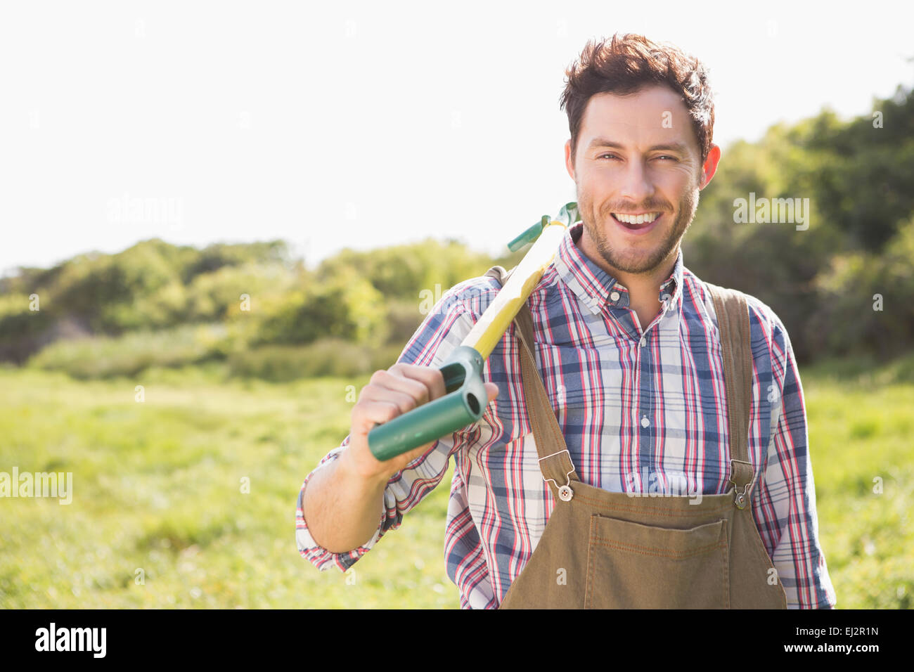 Happy farmer smiling at camera Stock Photo - Alamy