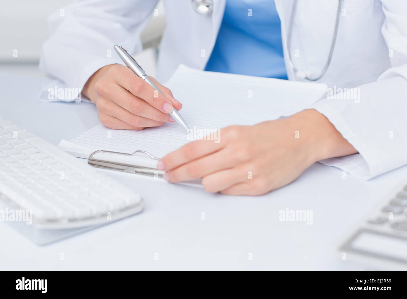 Female doctor holding paper hi-res stock photography and images - Alamy