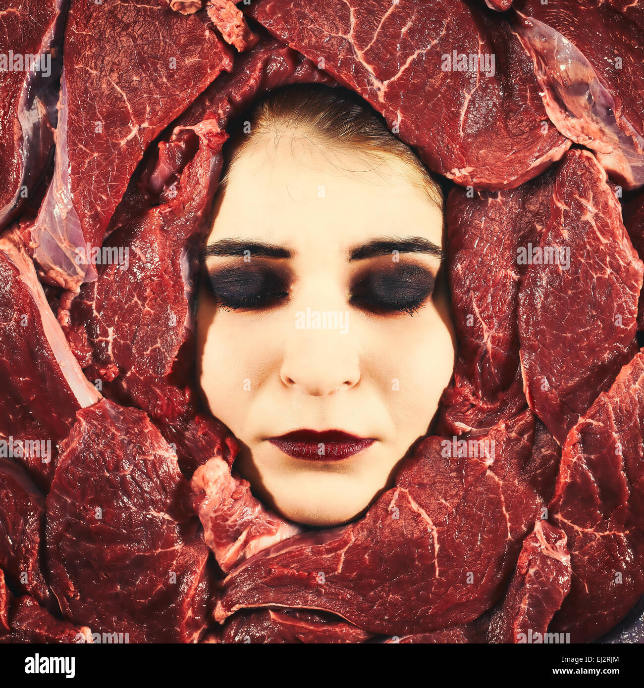 Beautiful woman expression face with beef frame, cross-processed image Stock Photo