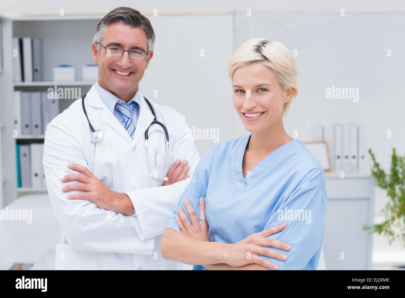 Doctor nurse standing arms hi-res stock photography and images - Alamy