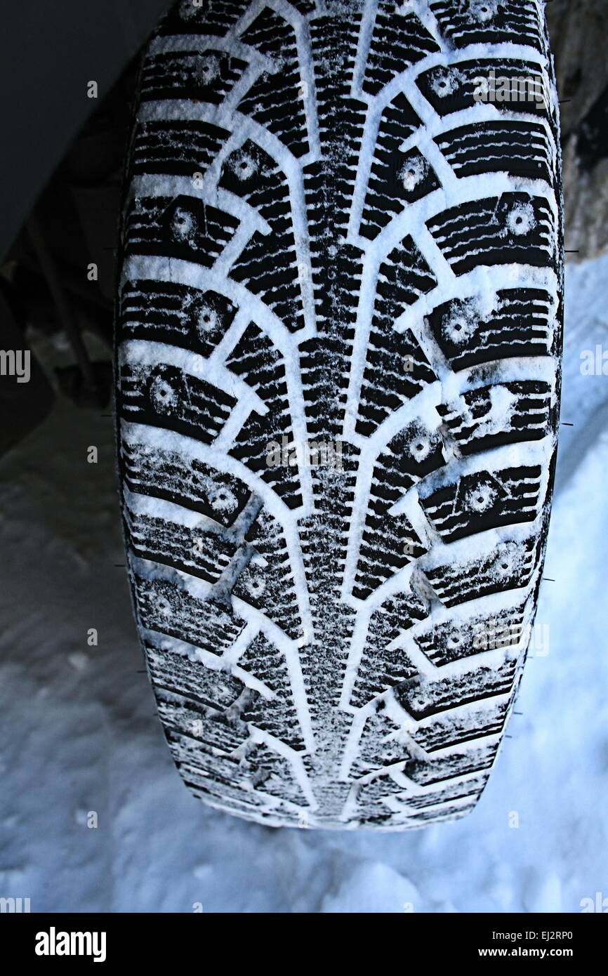 tread wheels Winter studded tires snow Stock Photo