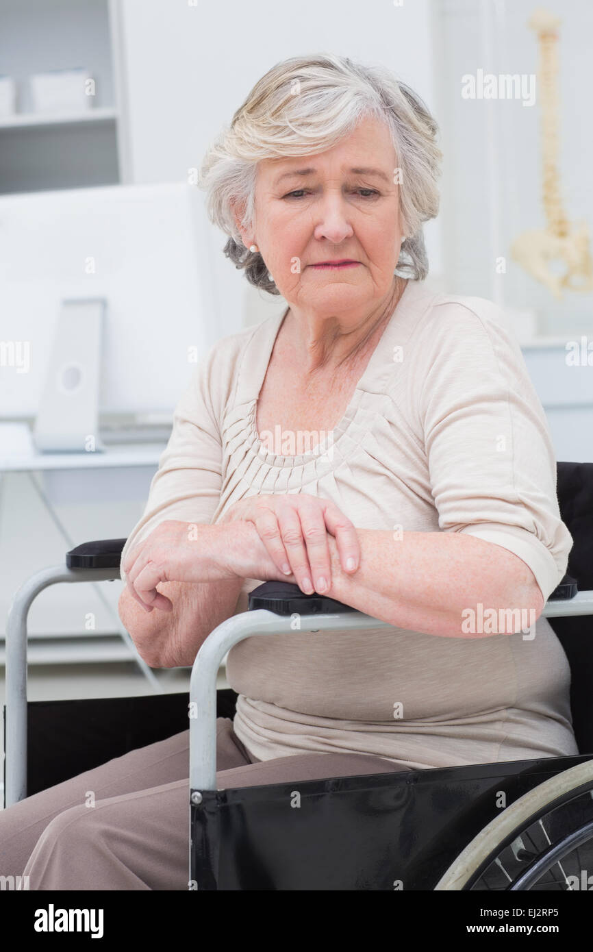 Sad senior patient sitting in wheelchair Stock Photo