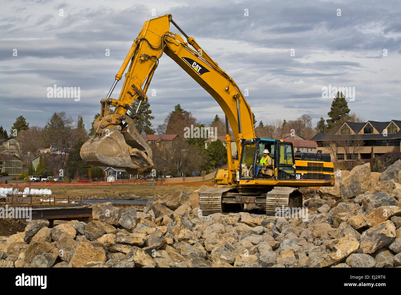 Heavy earthmoving shovels and other equipment working on changing the