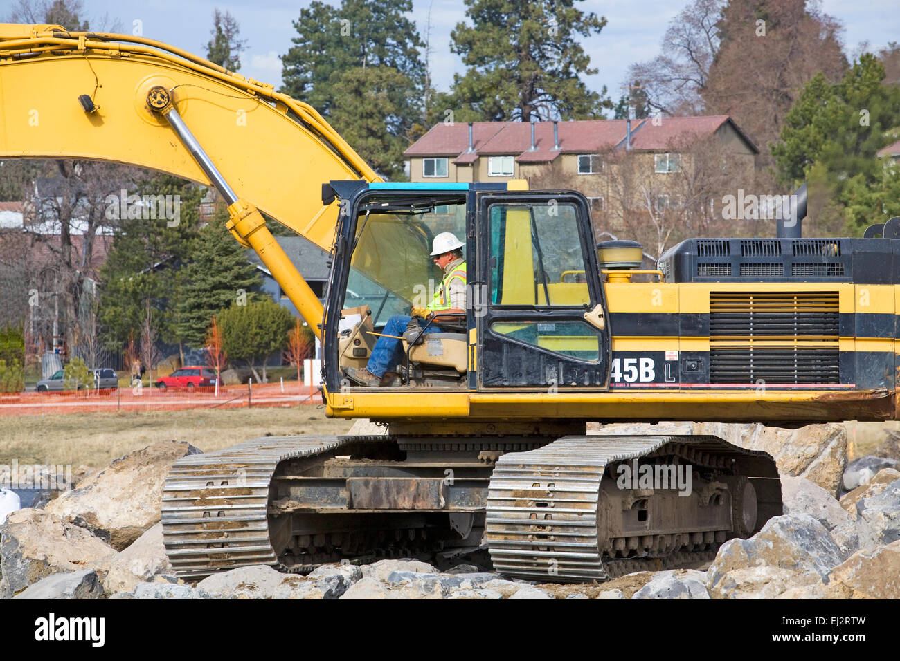 Heavy earthmoving shovels and other equipment working on changing the