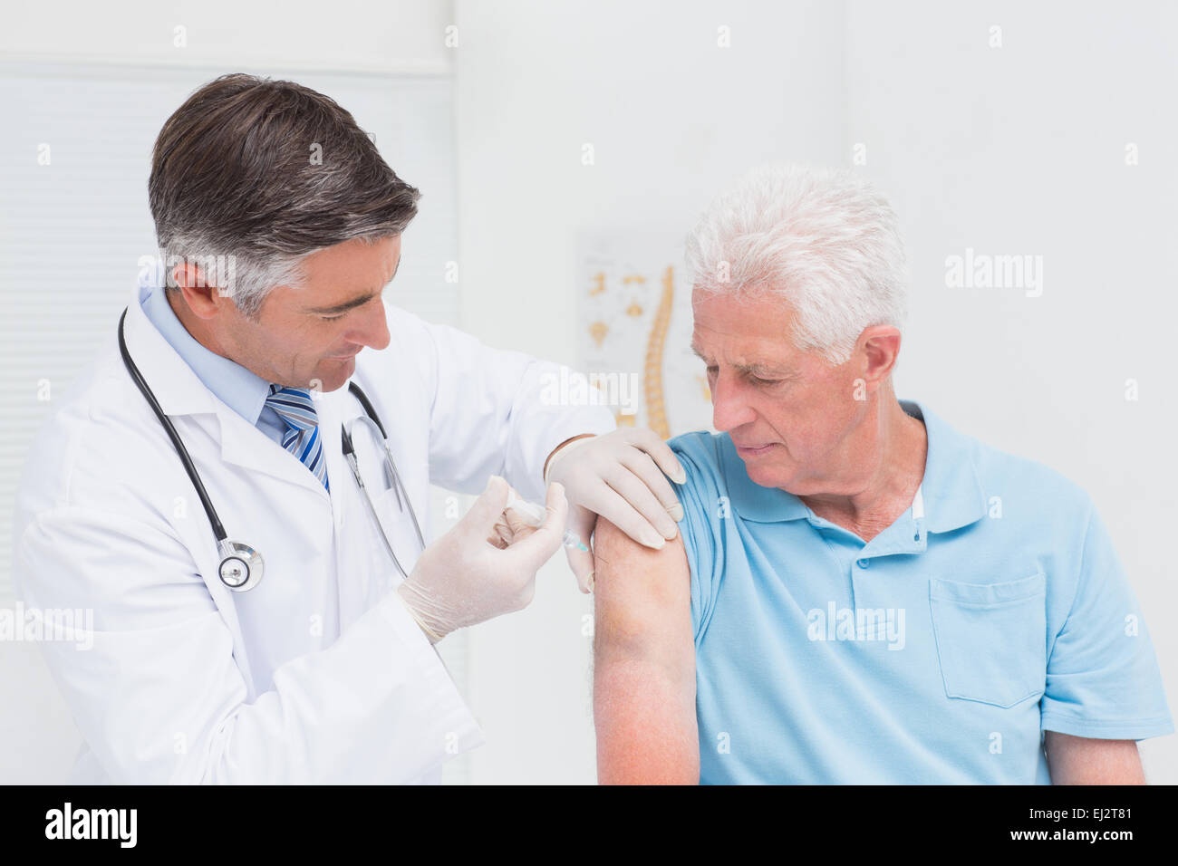 Old Practice Injection Doctor injecting senior patient in clinic Stock Photo - Alamy