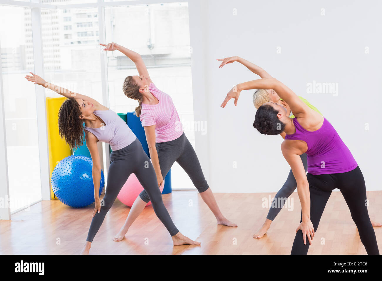 Female trainer class stretching hi-res stock photography and images - Alamy
