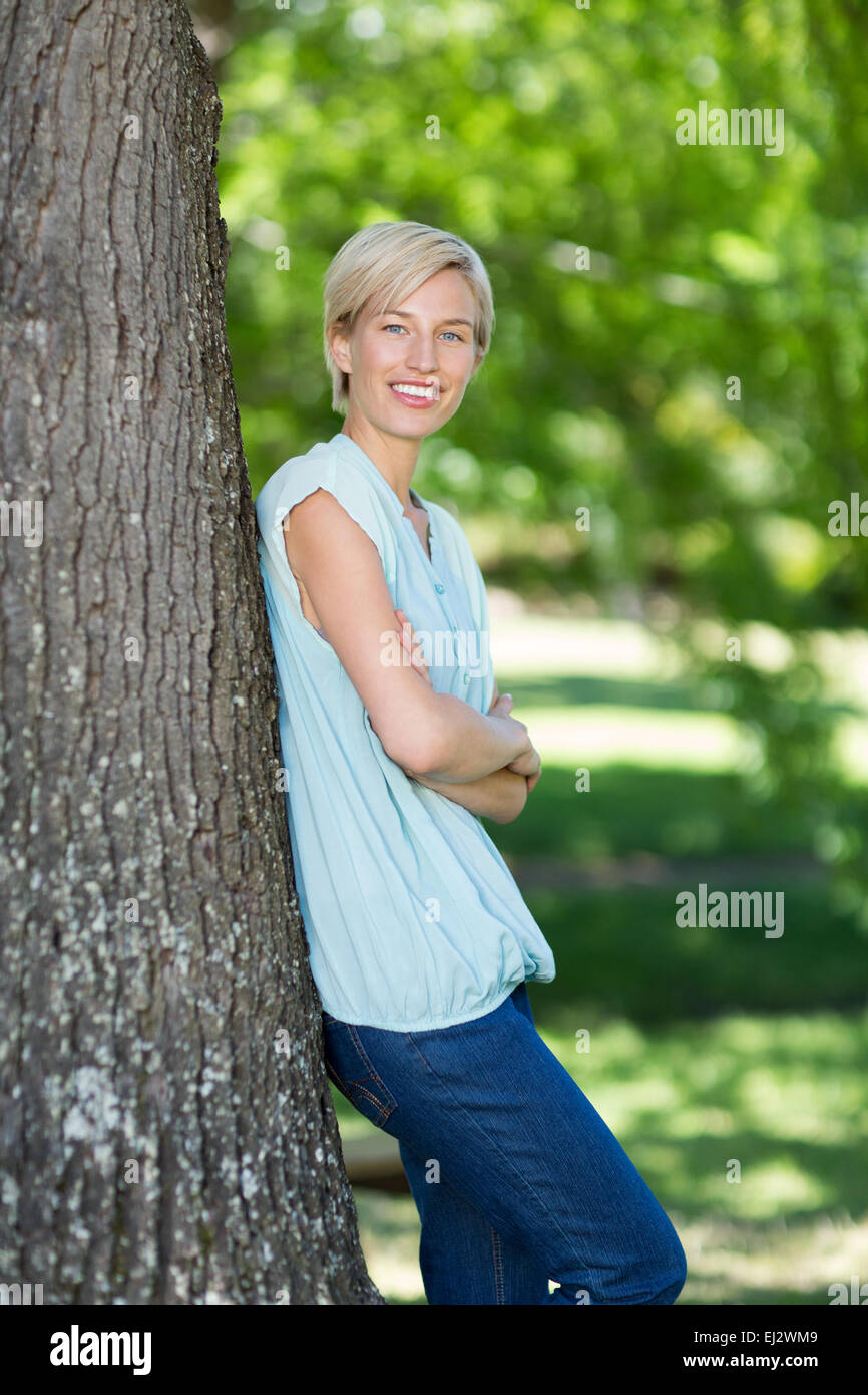 Pretty blonde smiling at the camera Stock Photo - Alamy
