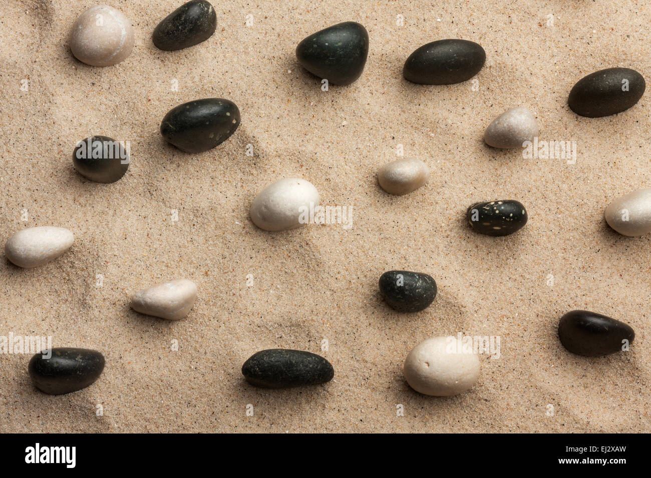 Rock Garden view from above, stone sticking out of the sand Stock Photo