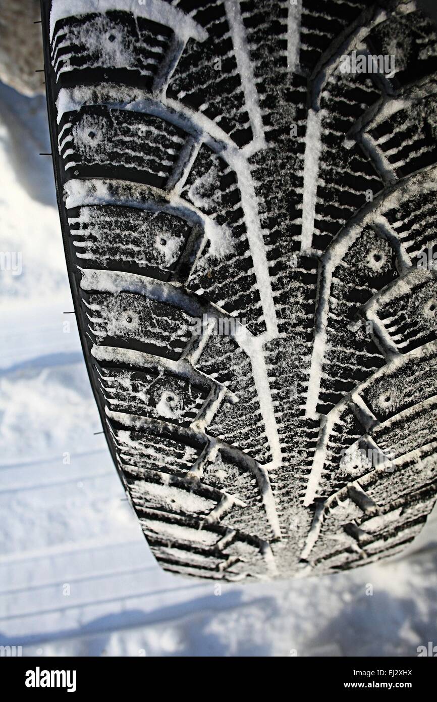 tread wheels Winter studded tires snow Stock Photo