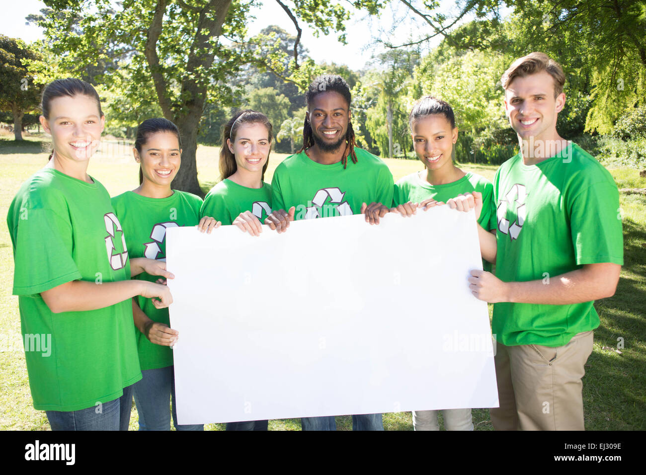 Happy environmental activists in the park Stock Photo - Alamy