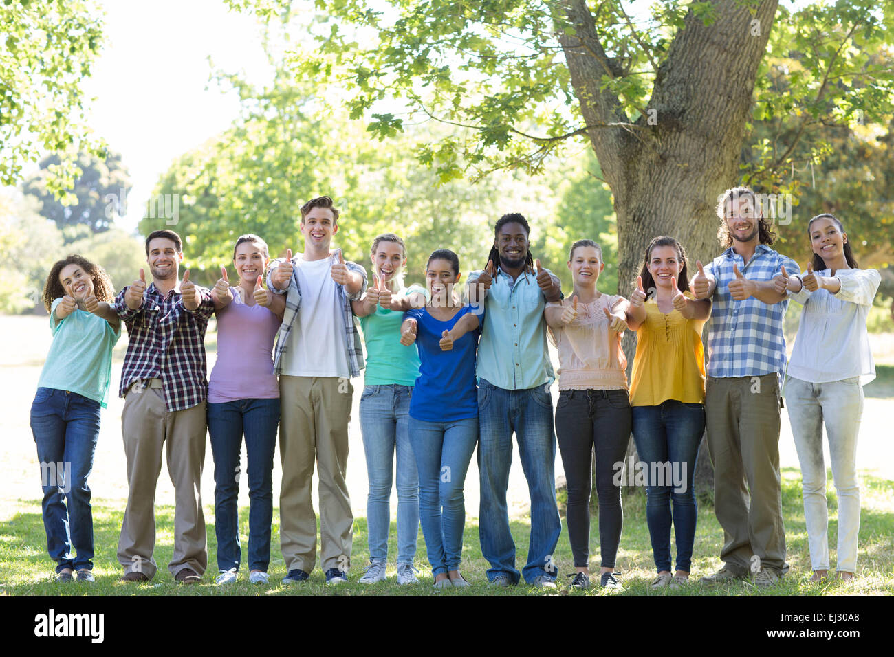 Happy friends in the park Stock Photo - Alamy