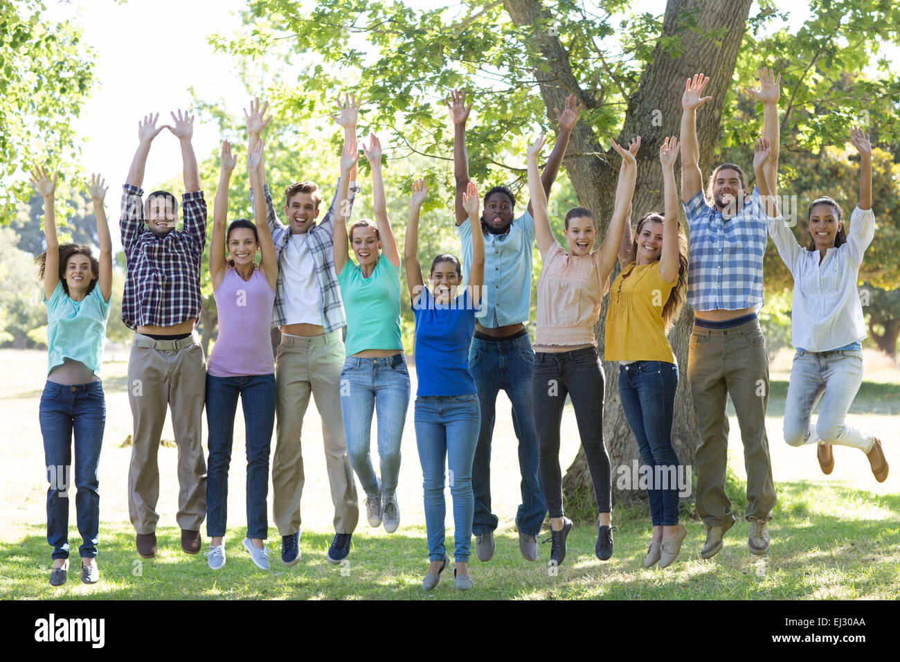 Happy friends in the park Stock Photo - Alamy
