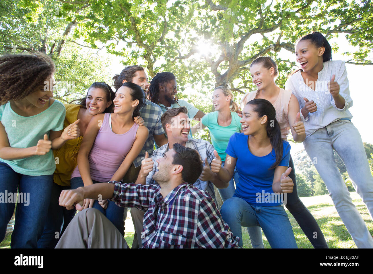 Happy friends in the park Stock Photo - Alamy