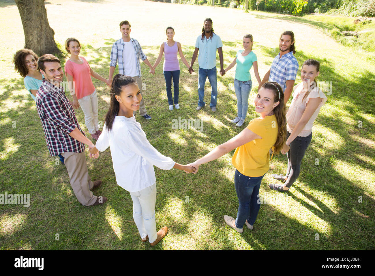 Holding hands circle hi-res stock photography and images - Alamy