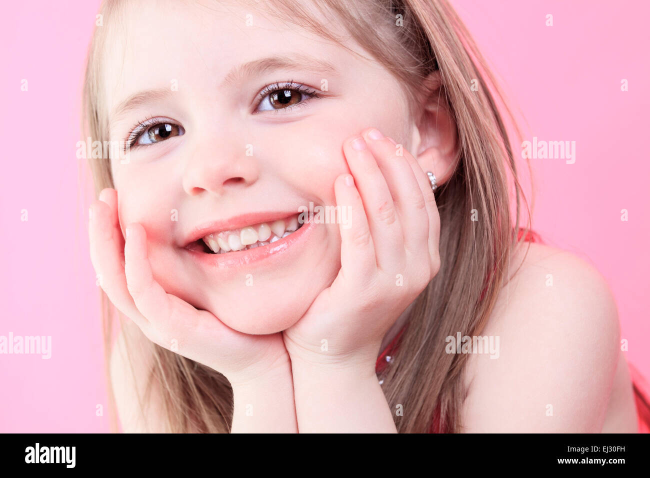 cute fashion little doll girl in pink background Stock Photo