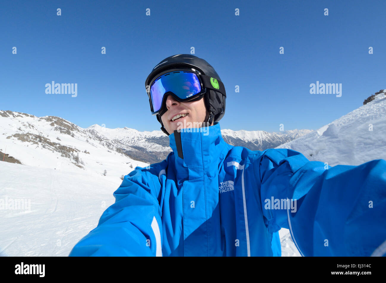 Young male skier taking a selfie photo on camera Stock Photo