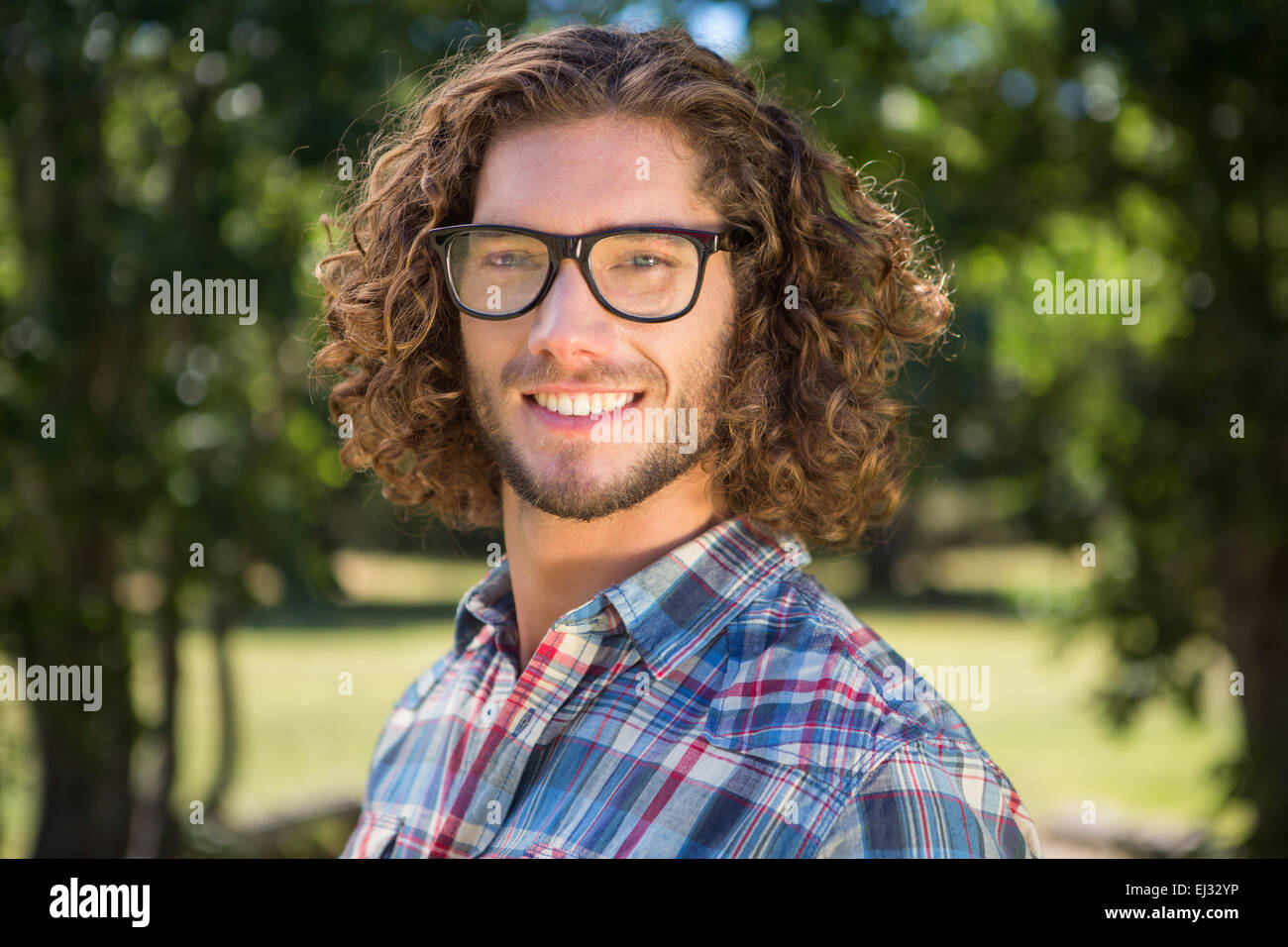 Young man smiling at camera Stock Photo - Alamy