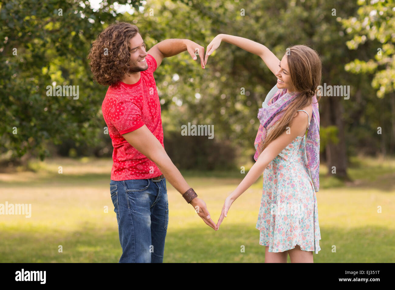 Couple making heart arms together hi-res stock photography and images -  Alamy