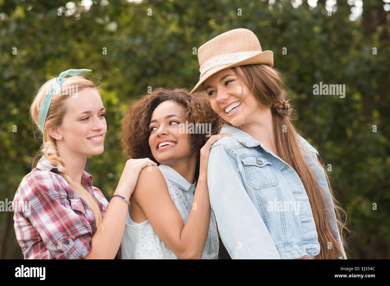 Happy friends in the park Stock Photo - Alamy