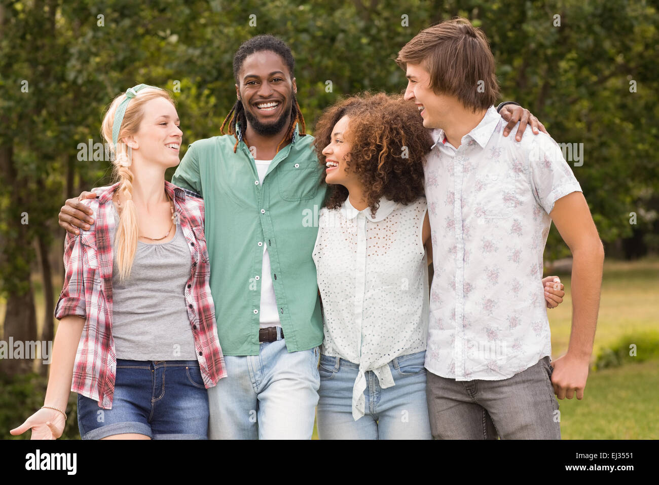 Happy friends in the park Stock Photo - Alamy