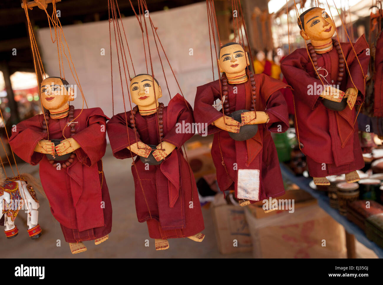 Buddhist monk string puppets for sale in a burmese village market stall, Inle Lake, Myanmar ( Burma ), Asia Stock Photo