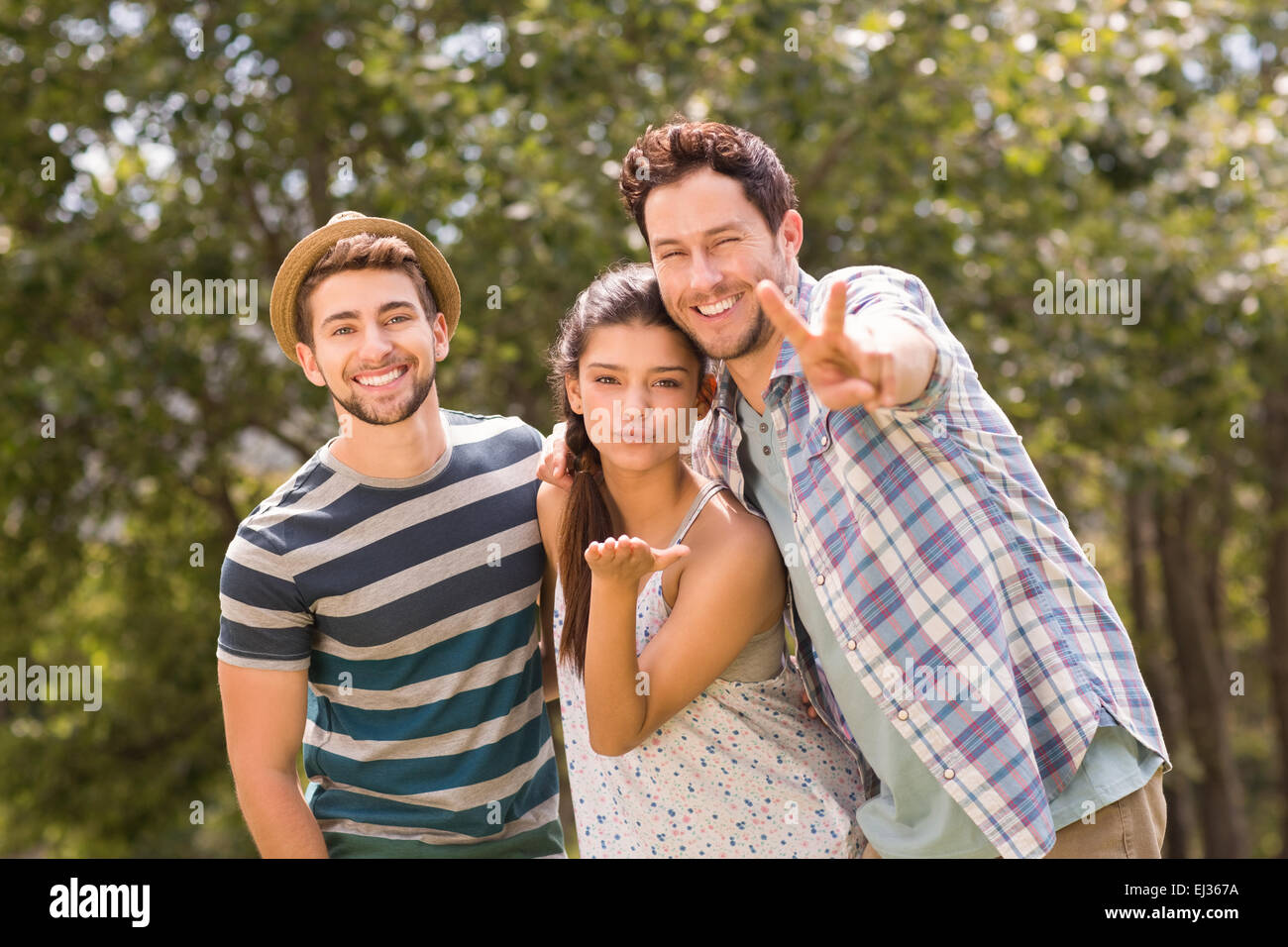 Happy friends in the park Stock Photo - Alamy