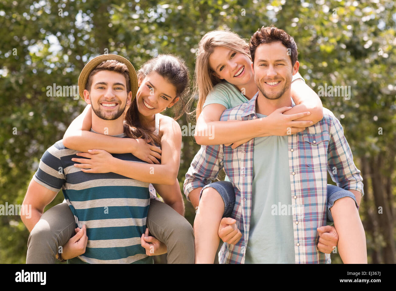 Happy friends in the park Stock Photo - Alamy