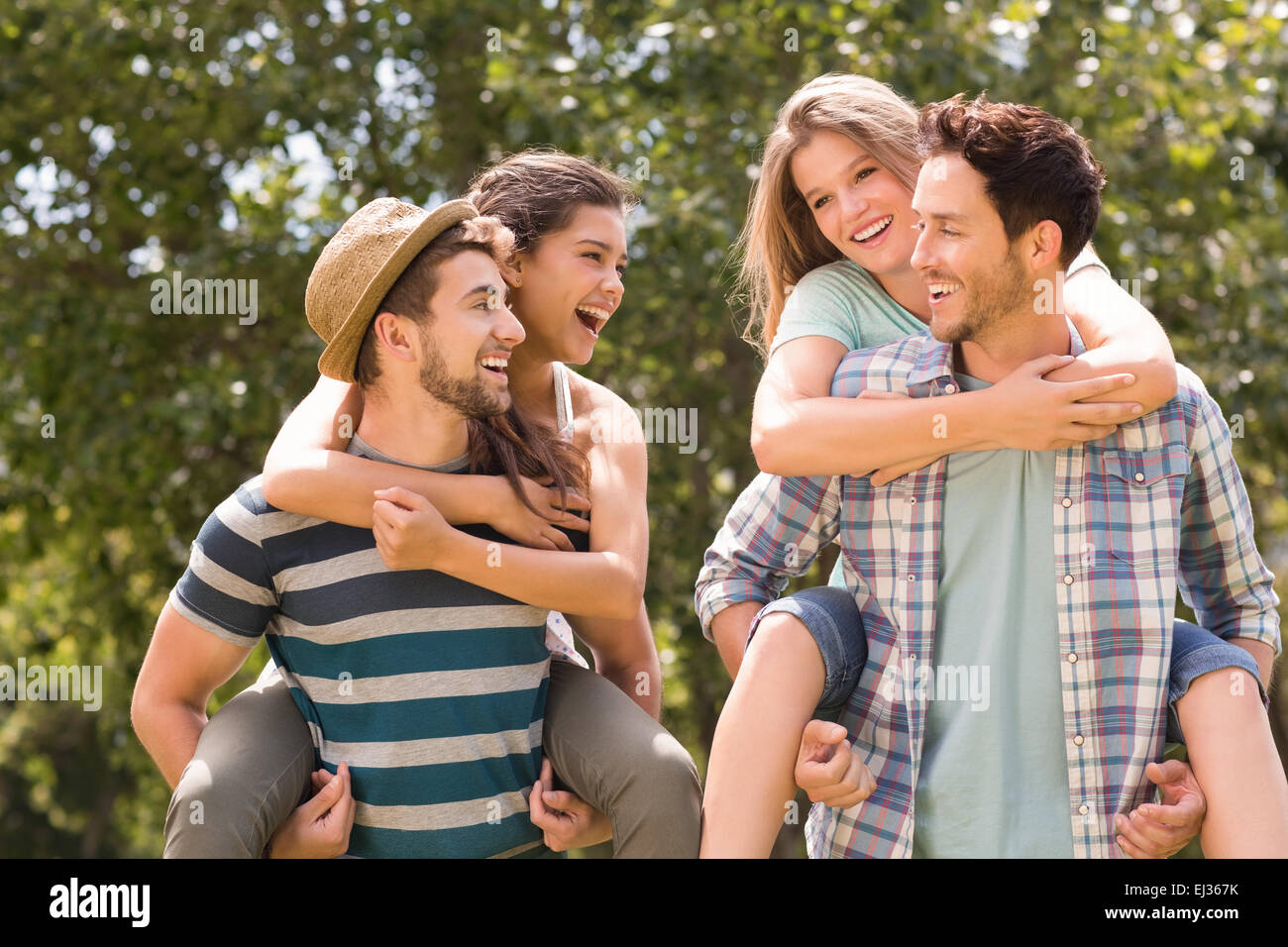 Happy friends in the park Stock Photo - Alamy