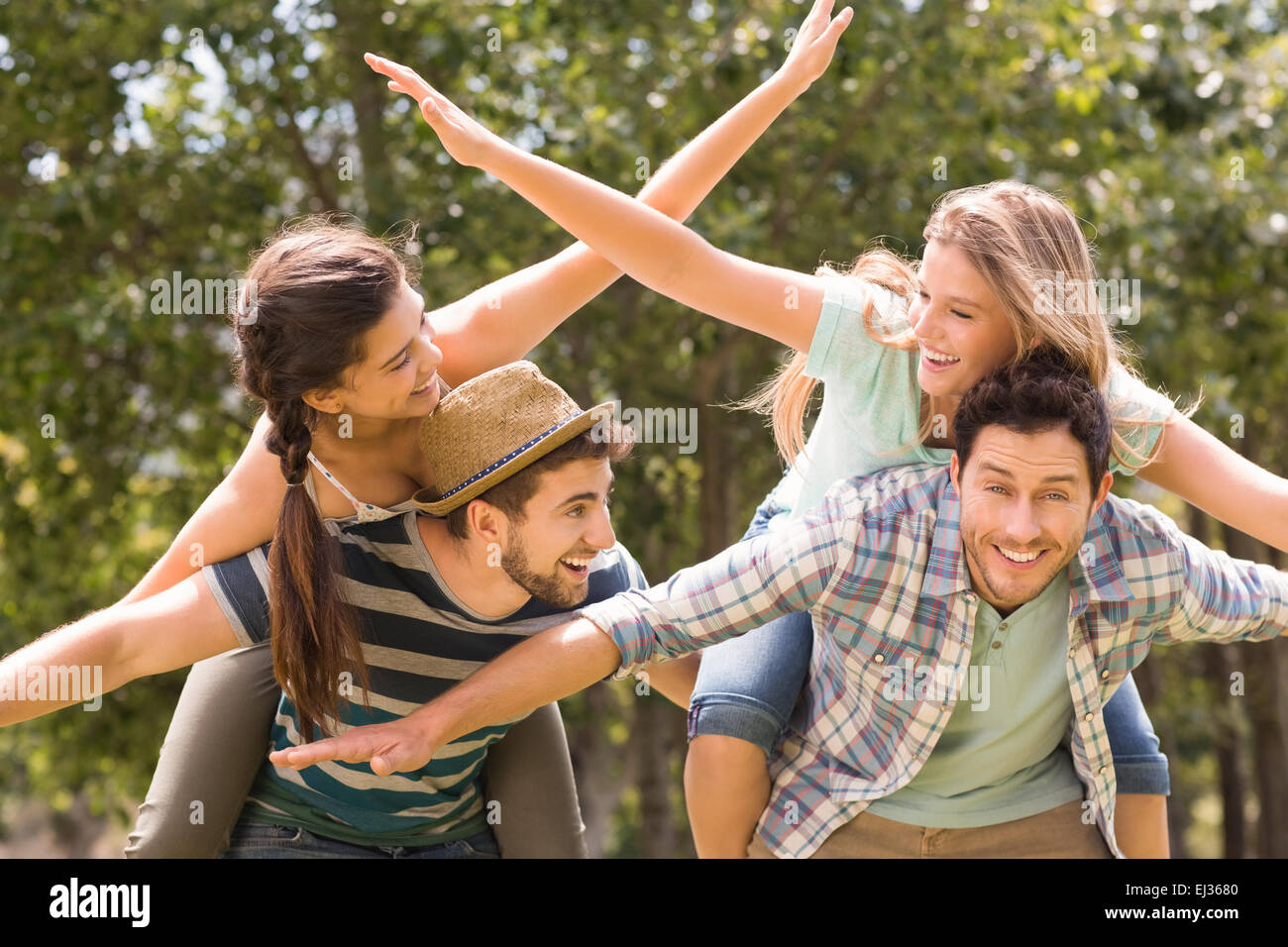 Happy friends in the park Stock Photo - Alamy