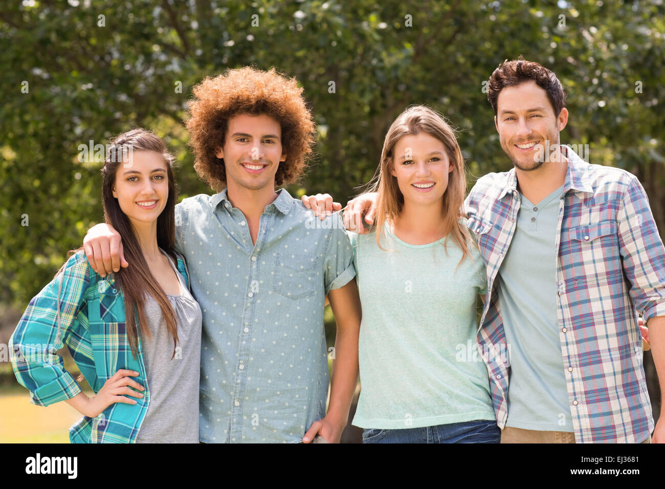 Happy friends in the park Stock Photo - Alamy