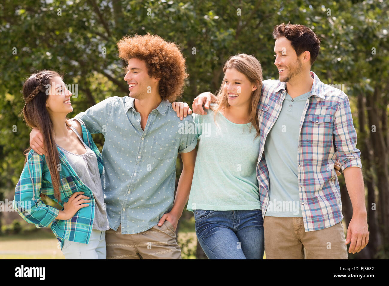 Happy friends in the park Stock Photo - Alamy