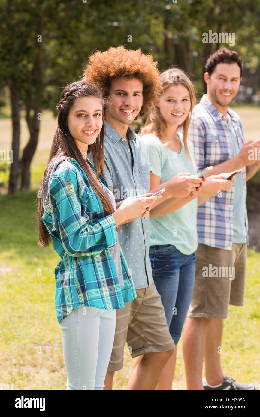 Happy friends in the park Stock Photo - Alamy
