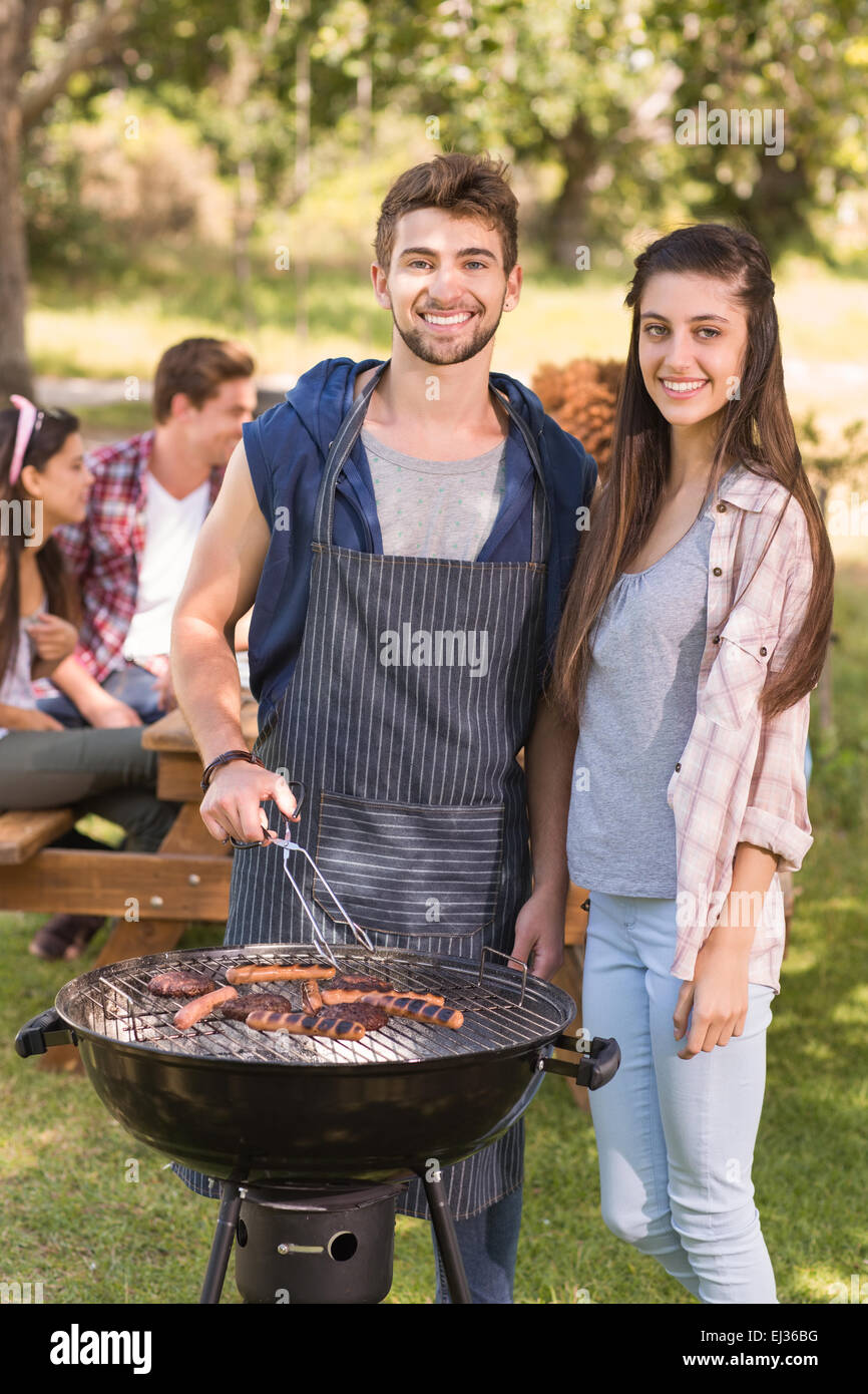 Happy friends in the park having barbecue Stock Photo