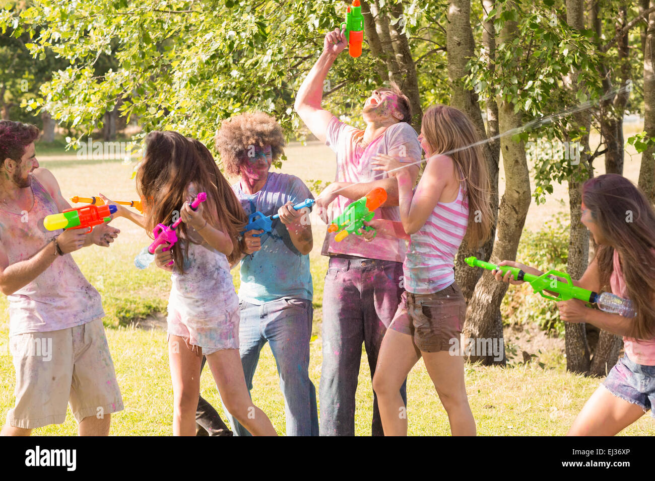 Powder Paint Playing Happy friends covered in powder paint Stock Photo - Alamy