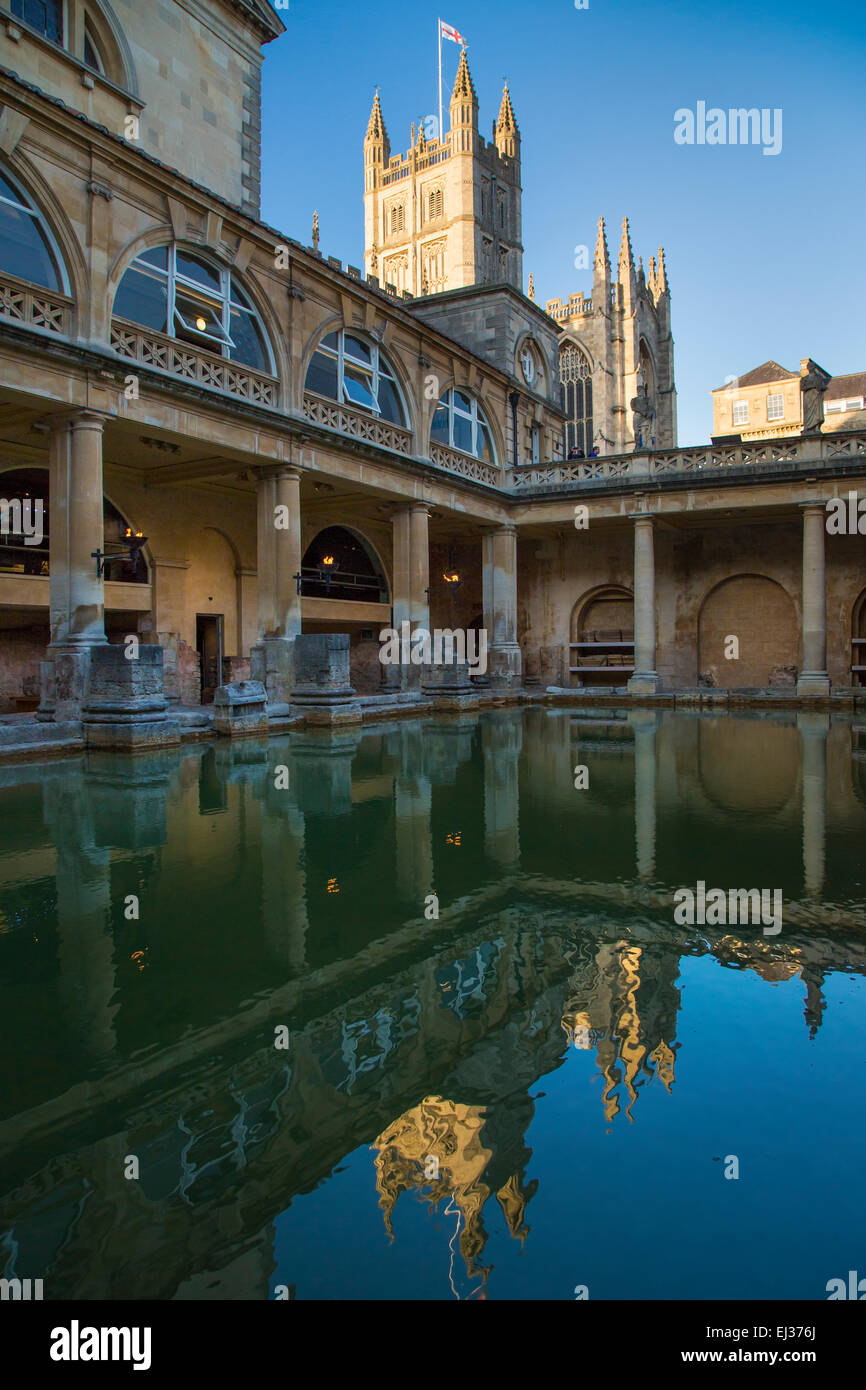 Great Bath at the Roman Baths with the Bath Cathedral beyond, Bath, Somerset, England, UK Stock Photo