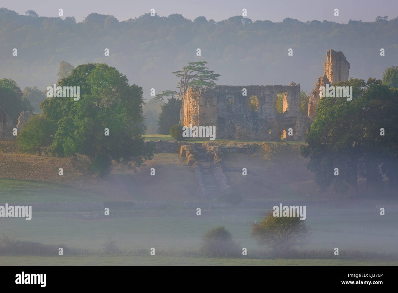 Misty dawn over Sherborne Castle - Sir Walter Raleigh's home, Sherborne, Dorset, England Stock Photo