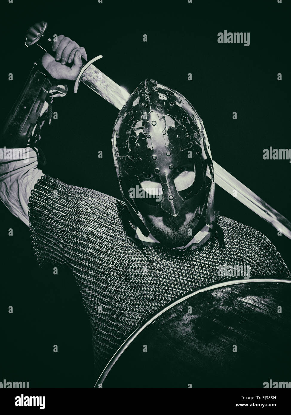 Medieval knight armor with a sword, helmet and shield, black and white ...