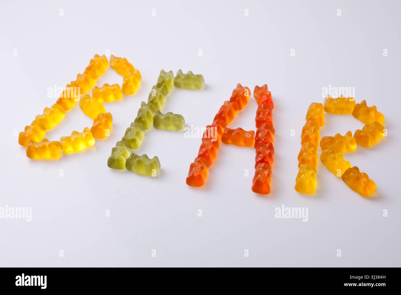 Letters made with colorful gummy bears making the word bear Stock Photo