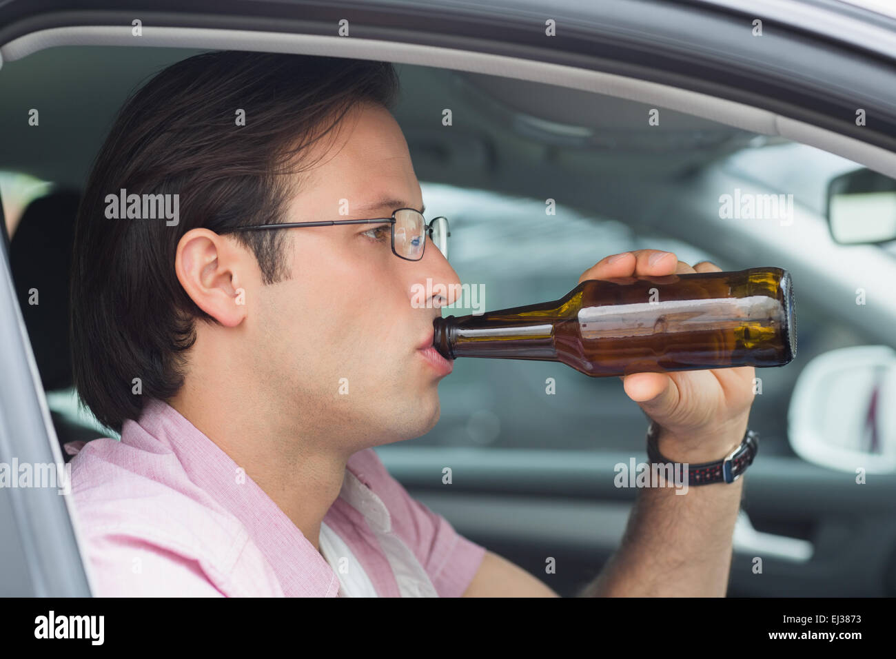 Man drinking beer while driving Stock Photo Alamy