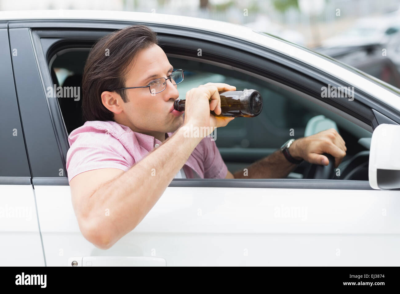 Man drinking beer while driving Stock Photo Alamy