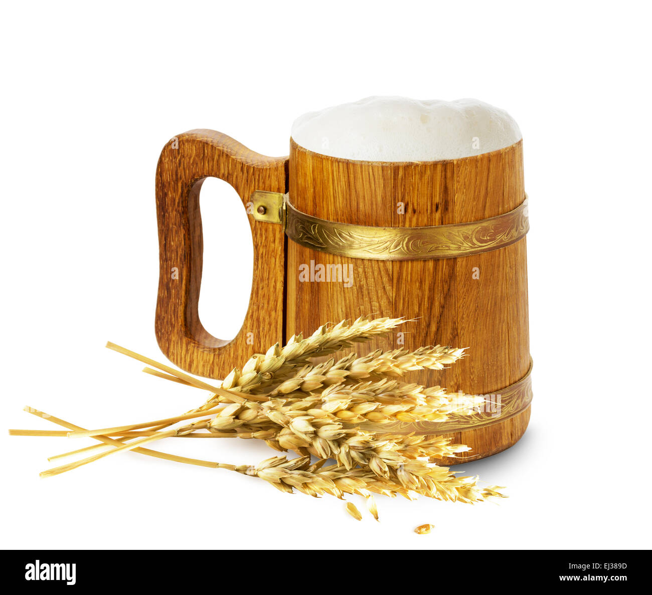 wooden mug with beer and wheat isolated on the white background. Stock Photo