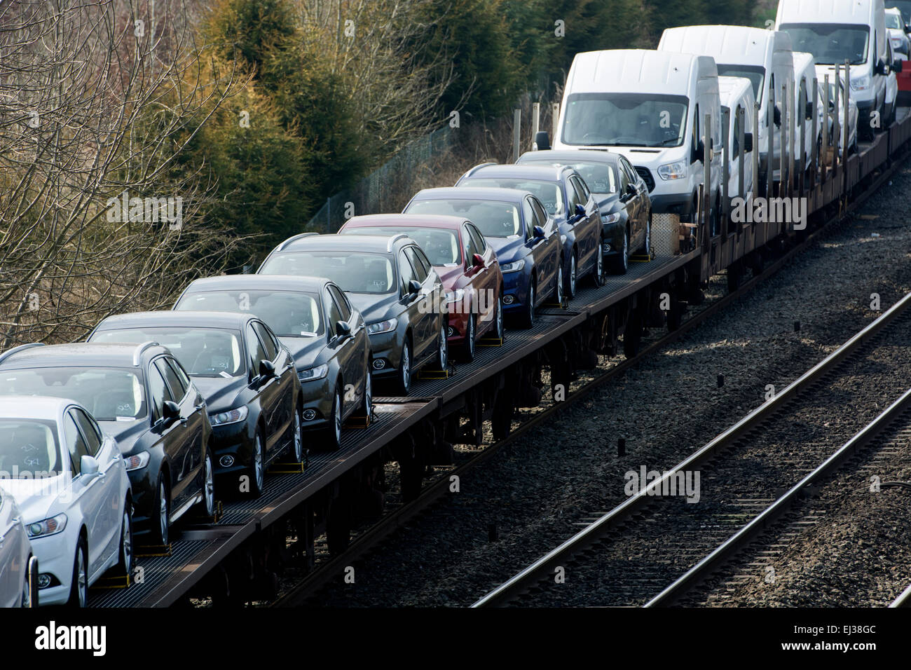 Train carrying new Ford cars and vans at Hatton Bank, Warwickshire, UK