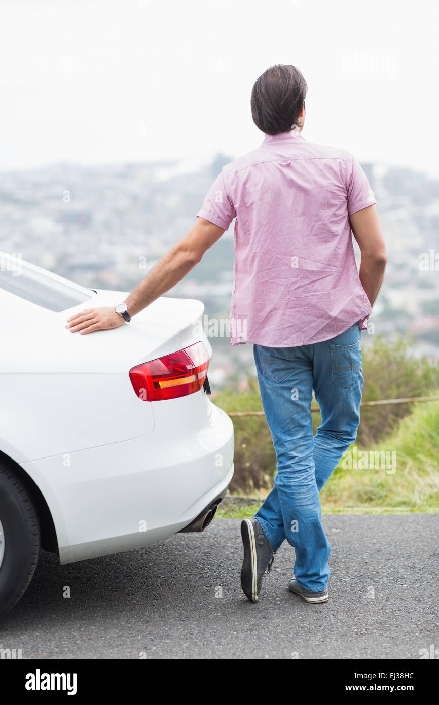 Man standing next to his car Stock Photo