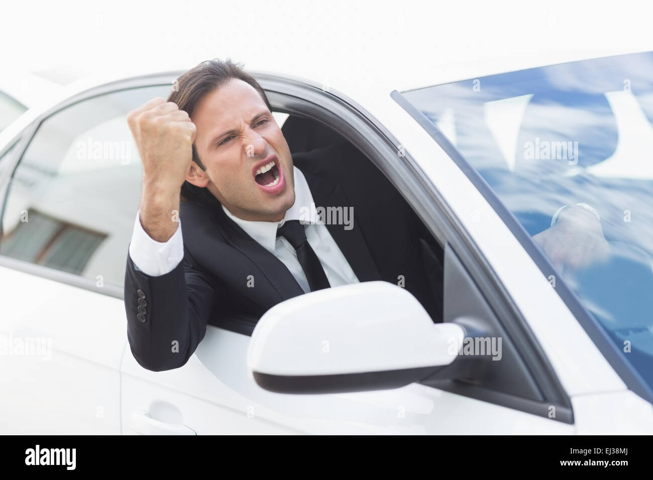 Businessman experiencing road rage Stock Photo - Alamy