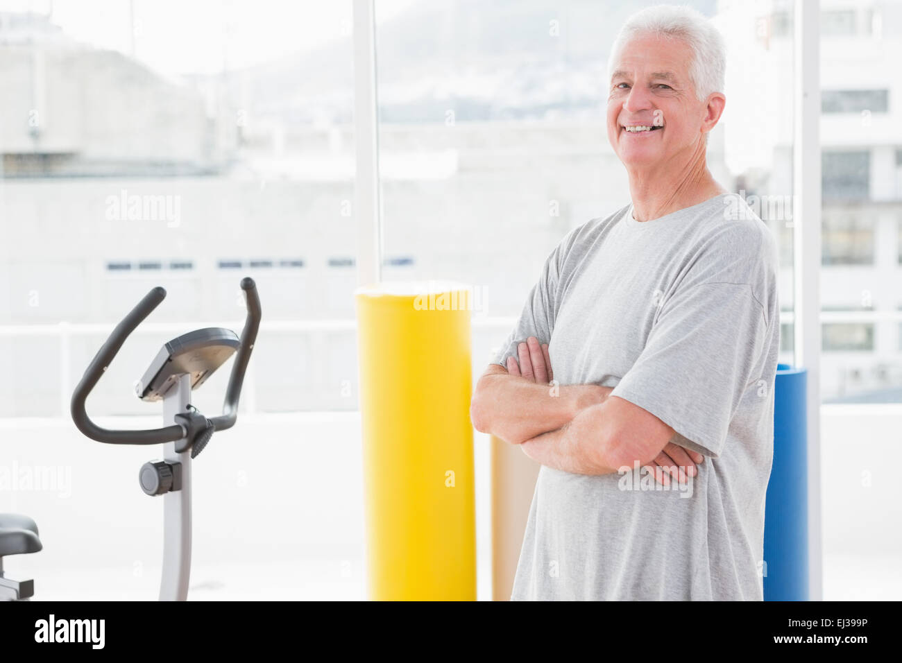 Senior man crossed arms hi-res stock photography and images - Alamy