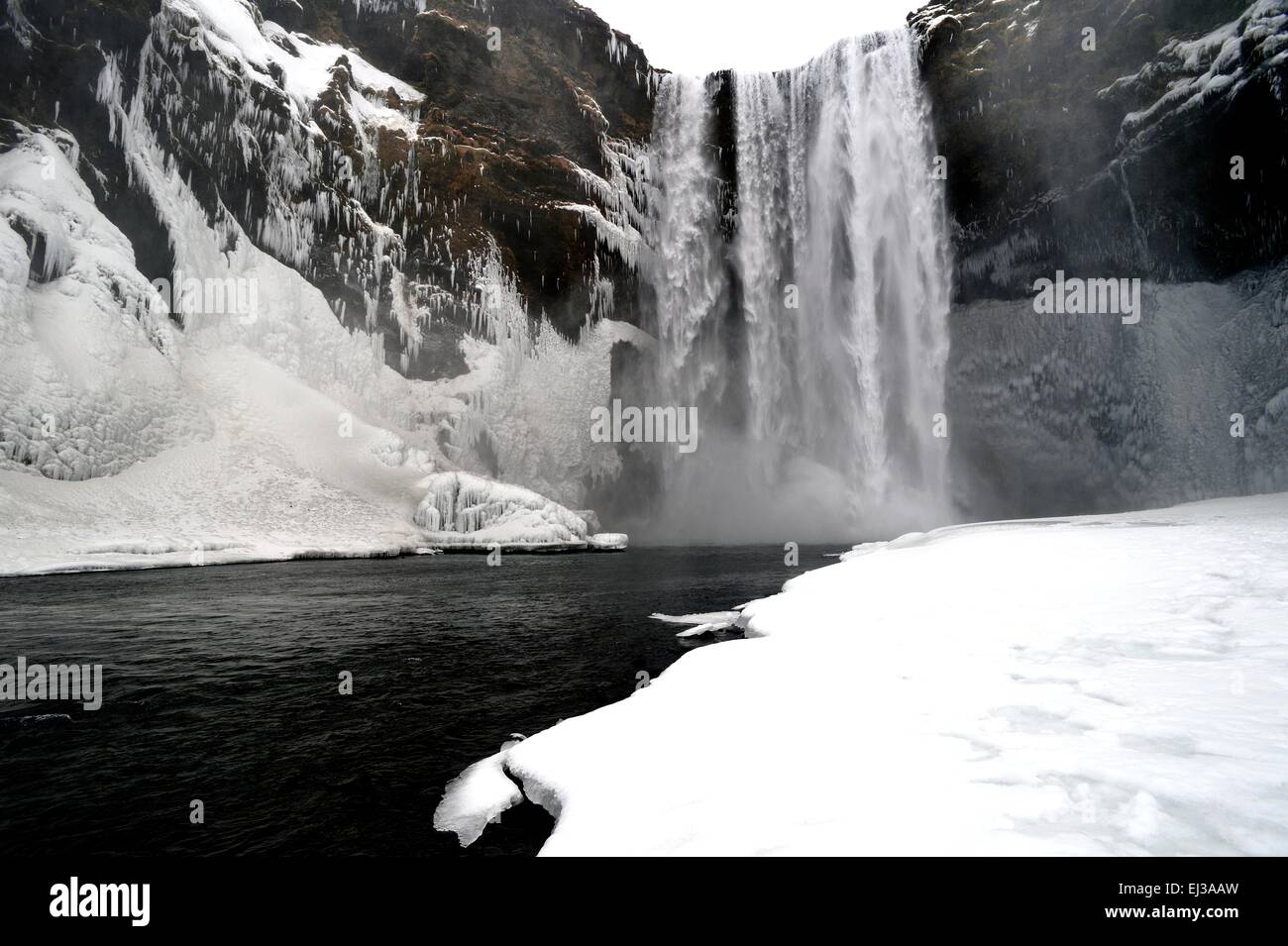 Skogafoss waterfall Iceland in snow during winter Stock Photo